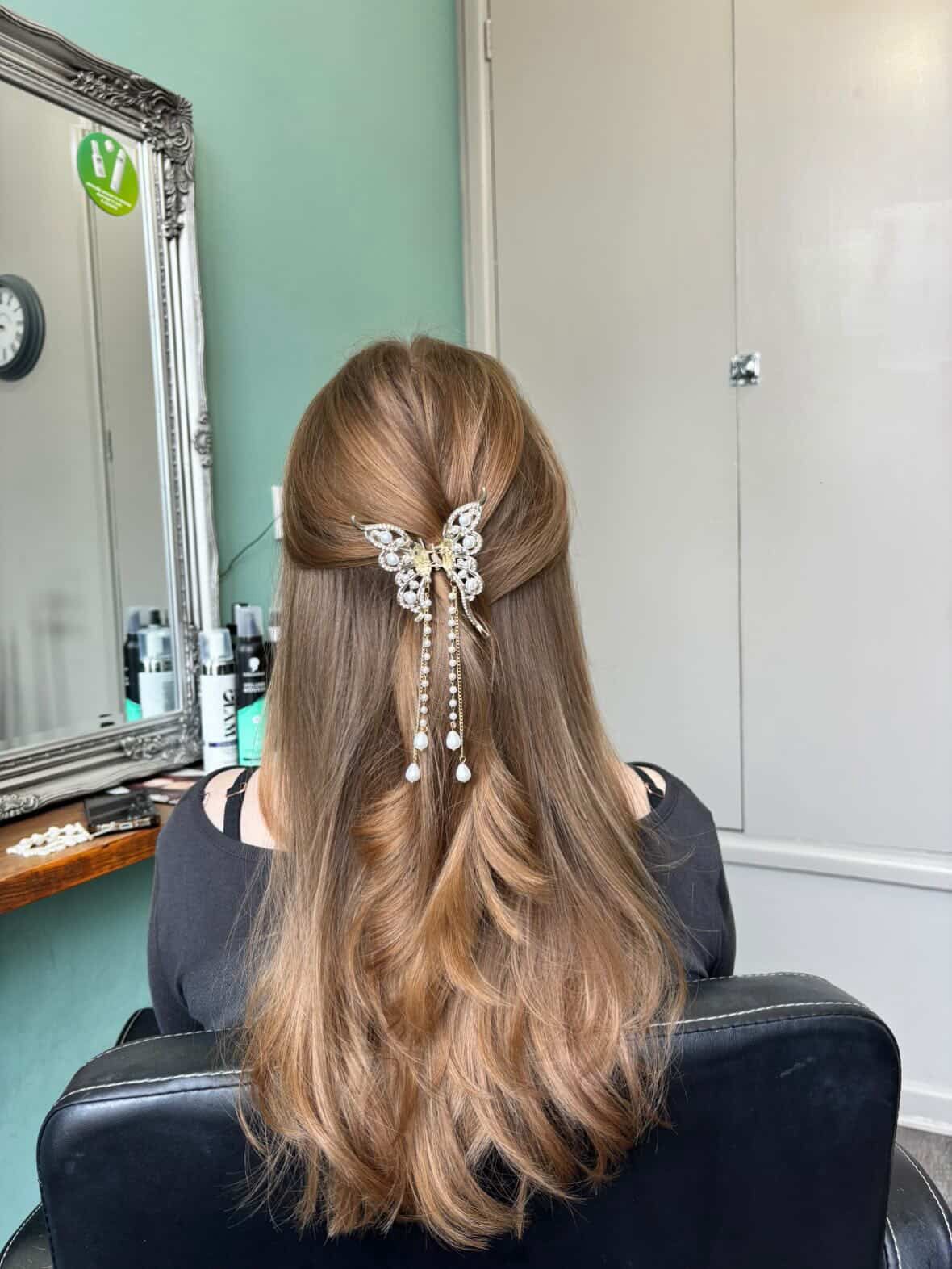 Curly updo with pearl accessories
