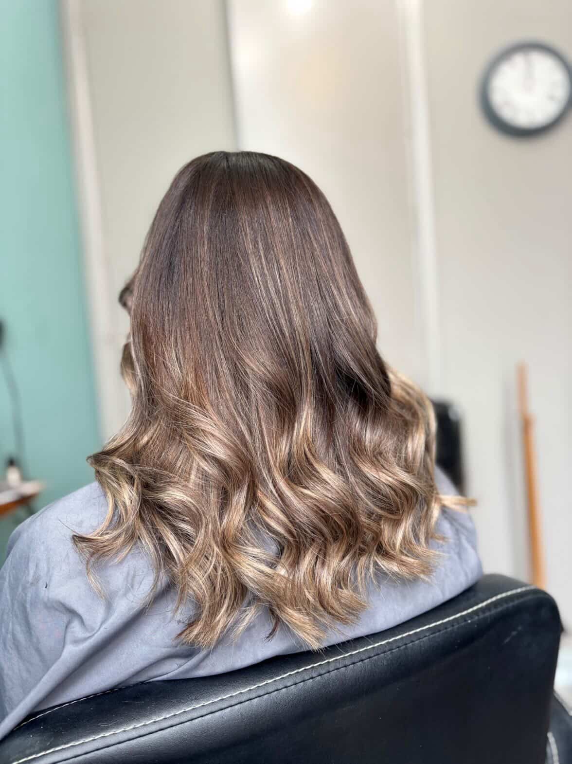 Curly bridal updo with pearl pins