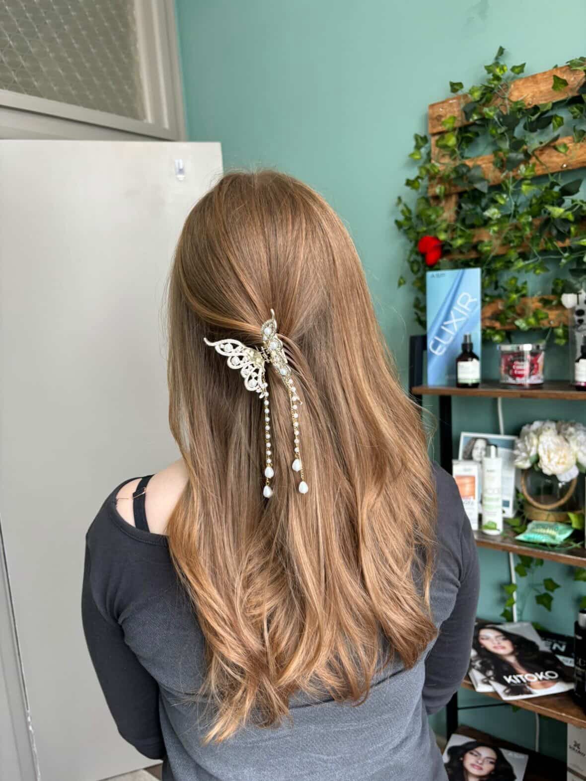 Curly updo with pearls, side view